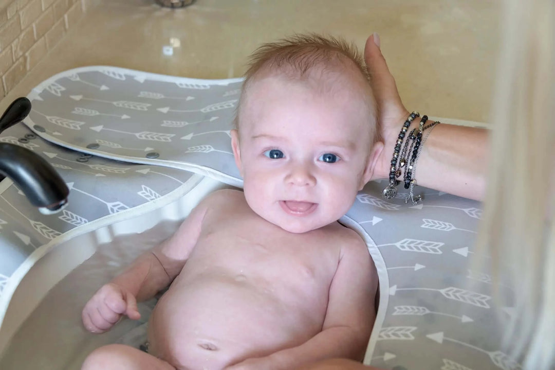 Newborn Baby Bath with a Splashpad Sink Mat and Faucet Guard