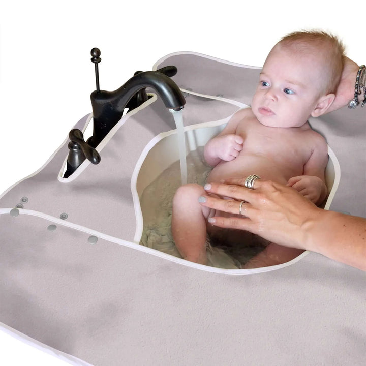 Newborn Taking a Soft Sink Bath - Soften Your Hard Sink Edges with a Splashpad Mat